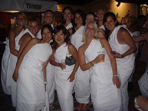 A typical attendee in a make-shift 'toga'A popular fad on college and university campuses in the United States and Canada, a toga party is a particular kind of costume party in which everyone wears a toga, or a semblance thereof, normally made from a bed sheet, and sandals. Toga parties were depicted in the 1978 film Animal House, which propelled the ritual into a widespread and enduring practice. Ivan Reitman was one of the producers of Animal House, who attended McMaster University and stayed in Whidden Hall, which is reputed to be the origin to the toga party. 